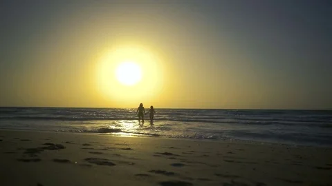 Romantic couple is falling in love on the beach in water. Man with woman is Stock Footage 79267141