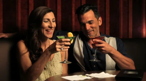 Romantic couple having alcoholic drinks Stock Footage 33046877