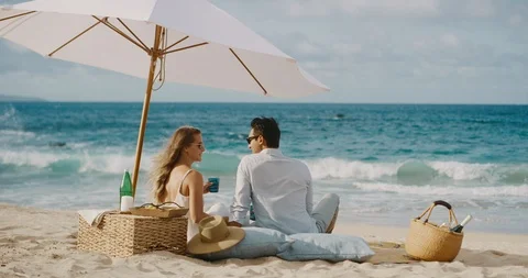 Romantic couple having a beach picnic Stock Footage 116254667