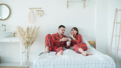 Romantic Couple Having Breakfast in Bed Stock Footage 119902792