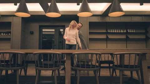 The romantic couple having a date at the empty restaurant. slow motion Stock Footage 168701644