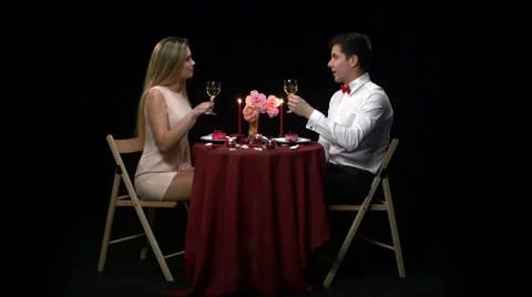 Romantic couple having dinner, clinking glasses Stock Footage 49746184