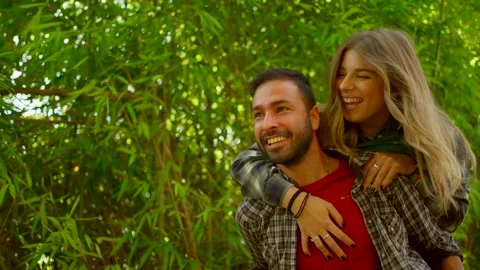 Romantic couple having fun in the forest on sunny day Video stock 333388040