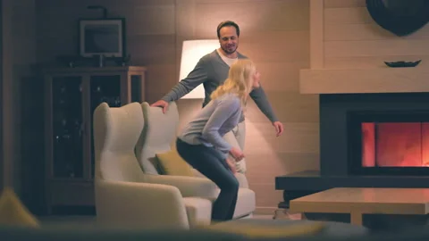 The romantic couple having rest at the fireplace. slow motion Video stock 168700420