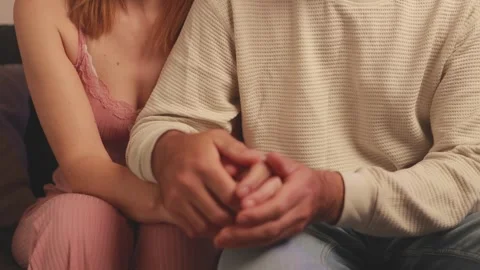Romantic couple holding hands, embracing intimately, conveying deep emotion.. Stock Footage 305695135