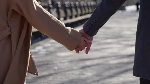 A Romantic Couple Holding Hands While Strolling Together in a Beautiful Park Video stock 314571872