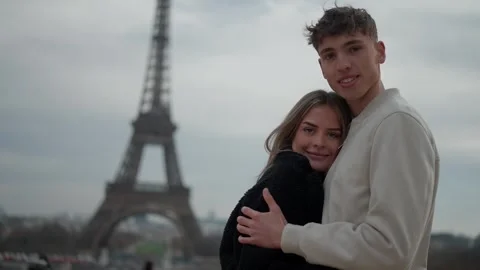 Romantic couple hugging with Eiffel Tower in background Paris France Portrait of Stock Footage 325231928