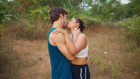 Romantic Couple Kissing Lustfully while Jogging Stock Footage 298236667