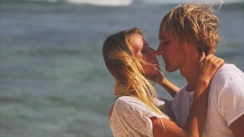 Romantic couple kissing on the seaside. Man and woman kissing Stock Footage