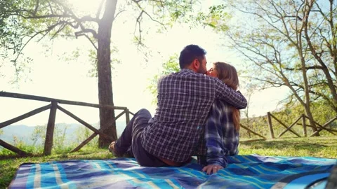 Romantic couple kissing while camping in nature Video stock 333386698