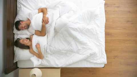 The romantic couple laying on the bed. view from above Vídeo Stock 90036565