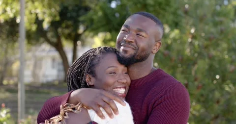 Romantic couple leaning into man's chest, hugging, adjusting, showing love in Stock Footage 346709111