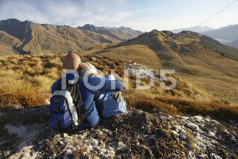 Romantic Couple Looking At Hills Stock Photos