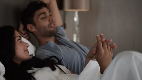 Romantic couple lying in bedroom. Stock Footage 119387791
