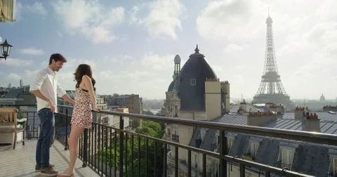 Romantic couple in Paris Eiffel Tower embrace kissing honeymoon enjoying Stock Footage 73351026