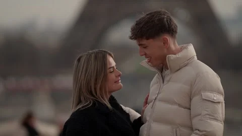 Romantic Couple in Paris with Eiffel Tower Background Young Lovers Enjoying Time Stock Footage 325234442