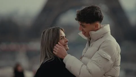 Romantic Couple In Paris With Eiffel Tower Background Young Man Touching Wo.. Stock-Fotos