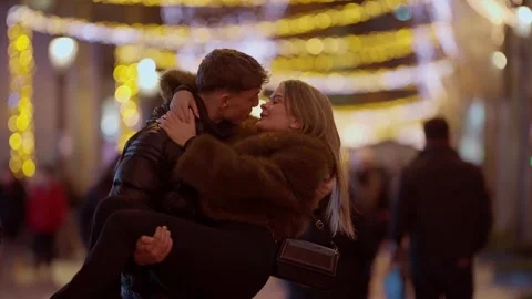 Romantic Couple in Paris at Night Man Carries Woman in Arms Bokeh Lights Love Stock Footage 325273698