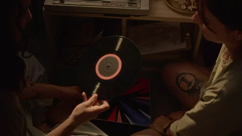Romantic Couple Placing Vinyl Record on Turntable Stock-Footage 345230953