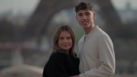 Romantic Couple Posing in Paris with Eiffel Tower Background Young Lovers Stock Footage 325246537