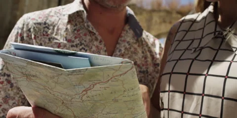 Romantic couple reading a map Stock Footage 58926256