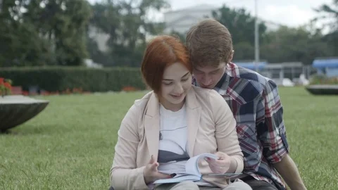 Romantic couple reading together 動画素材 77849175