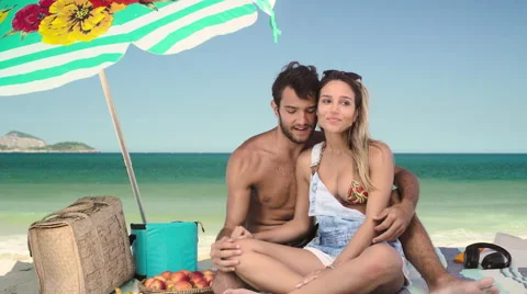 Romantic couple relaxing and having skewered fruits on beach Stock Footage 59441568