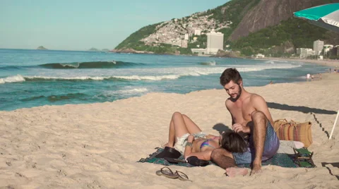 Romantic couple relaxing on Ipanema beach Stock Footage 59374598