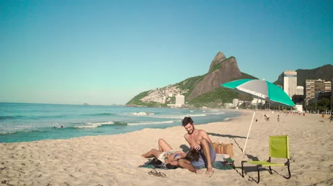 Romantic couple relaxing on Ipanema beach Stock Footage 59378741