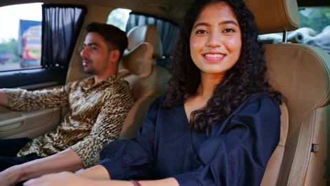 Romantic couple sits inside car during holiday time Stock Footage 311147558