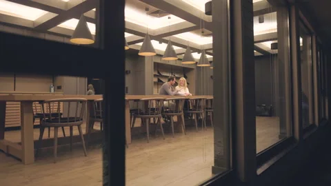 The romantic couple sitting at the night empty bar. slow motion Stock Footage 168701344