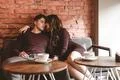 The romantic couple sitting in the restaurant Photo