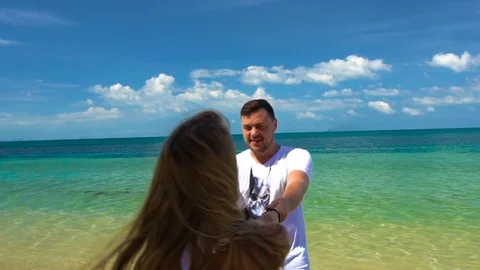 Romantic Couple Spin on the Beach Stock Footage 70973456