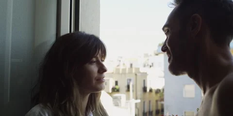 Romantic couple standing in balcony Stock Footage 58860434