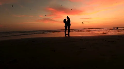 Romantic couple standing at beach Stock Footage 135896937