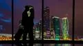 The romantic couple standing in the big hall with a beautiful night sky view Photo