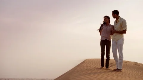 Romantic couple standing on desert. Stock Footage 119383309