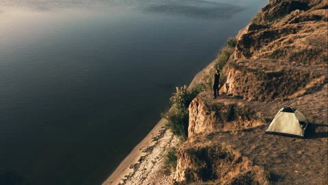 The romantic couple standing on the mountain cliff against the sea Stock Footage 156642884