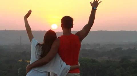 Romantic couple standing on the mountain. Video stock 38937536