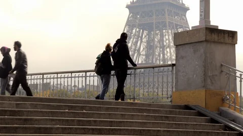 Romantic couple starring at the Eiffel tower in Paris France Stock Footage 106356305