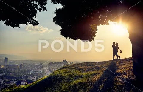 Romantic Couple at sunset city view Stock Photos