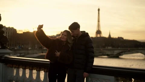 Romantic Couple Taking Selfie with Eiffel Tower in Paris France at Sunset Golden Stock Footage 328573424