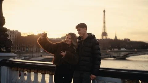 Romantic Couple Taking Selfie With Eiffel Tower In Paris France At Sunset T.. Stock Photos