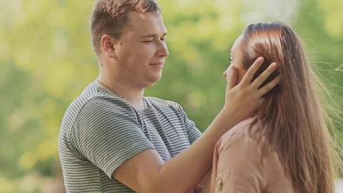 Romantic couple together on nature. They look into each other's eyes. Gentle Stock Footage