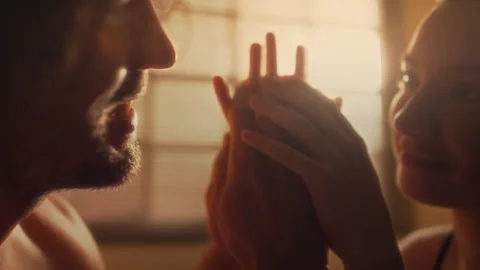 Romantic Couple Touching Hands and Smiling in Bedroom Stock Footage 265053146