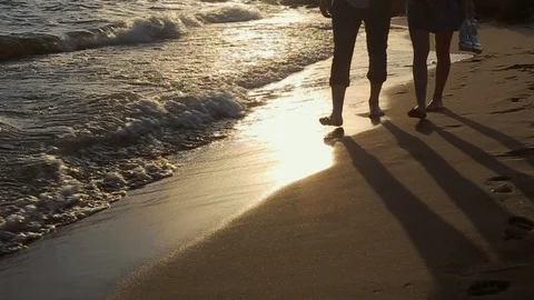 Romantic Couple Walking Barefoot Along Summer Beach At Sunset Stock Footage