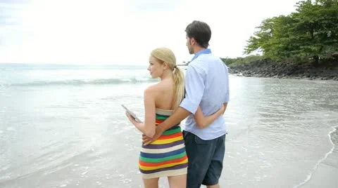 Romantic couple walking by the beach Stock Footage 14827817