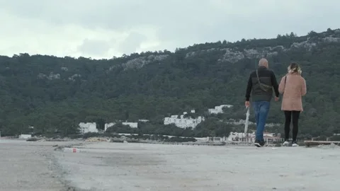 Romantic couple walking on beach Stock Footage 167348010