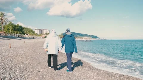 Romantic couple walking on beach Stock Footage 167361071