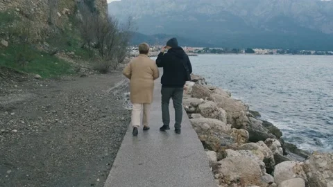 Romantic couple walking on beach Stock Footage 167372856